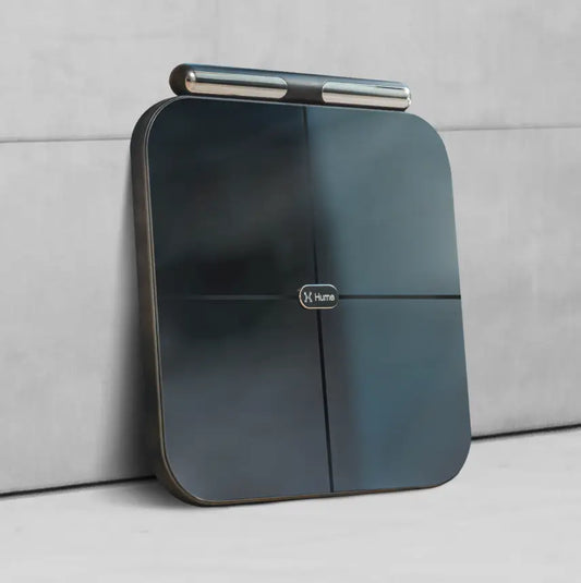 Hume Body Pod body composition analyzer standing against a grey wall