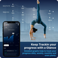An infographic titled "Keep Tracking your progress with a Glance," showing a woman doing a yoga backbend pose with overlaid data points tracking body fat percentage and weight trends over time (ranging from 26.5% to 23.4% body fat, and 130 lb to 126.5 lb weight). A smartphone mockup on the left displays the Body Pod app interface with a muscle mass graph and an insight noting "Your Body Water is Low." Text below highlights that detailed graphs help track progress daily, weekly, monthly, and yearly.